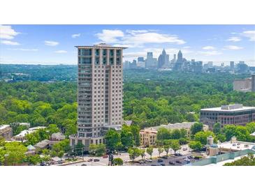 A high-rise building overlooking lush greenery and the city skyline at 2881 Peachtree Ne Rd # 1102, Atlanta, GA 30305