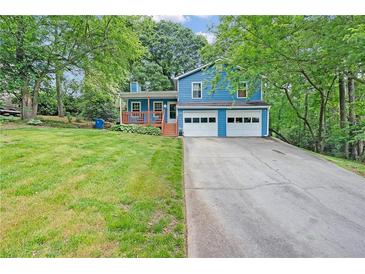 Charming, two-story home featuring a freshly painted exterior and a two-car garage at 3178 Booths Ct, Dacula, GA 30019