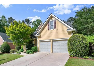Charming two-story home featuring a two-car garage and well-maintained landscaping at 4085 Tritt Homestead Dr, Marietta, GA 30062