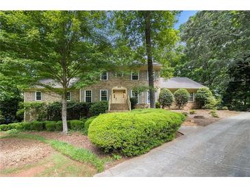 Charming brick home with well-manicured landscaping and a welcoming entrance at 4981 Forestglade Ct, Stone Mountain, GA 30087