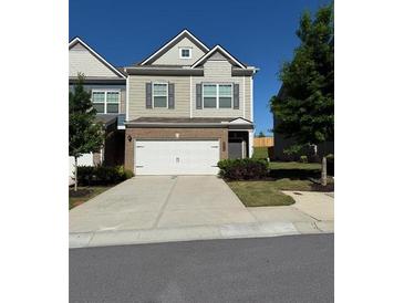 Charming two-story home with a two-car garage and well-maintained landscaping at 5726 Silver Lake Dr, Mableton, GA 30126