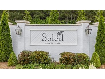A welcoming entrance sign for the Soleil Belmont Park community with beautiful landscaping at 438 Southland Cir, Canton, GA 30115