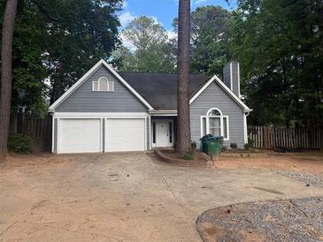 Charming single-Gathering home with a two-car garage and well-maintained lawn at 2032 Hopkins Mill Road, Duluth, GA 30096