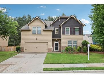 Two-story home with a two-car garage and well-maintained lawn and landscaping at 2760 Lions Gate Dr, Cumming, GA 30041