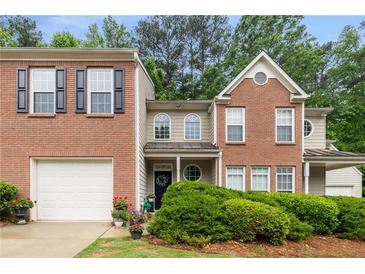 Charming brick home with manicured landscaping and a welcoming front entrance at 360 Parkview Manor Dr, Tucker, GA 30084