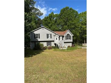 Charming two-story home with gray siding, black shutters, and a well-maintained front yard at 615 Amberwood Pl, Euharlee, GA 30145