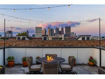 Relax on this rooftop patio with a fire pit and gorgeous skyline views at 250 Castleberry Station Sw Dr, Atlanta, GA 30313