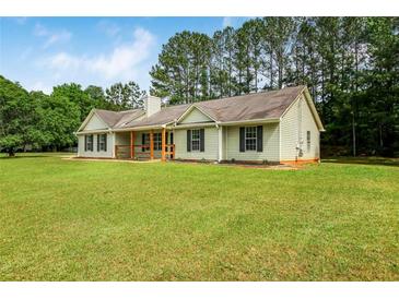 Charming single-story home with green lawn and mature trees at 102 Aristocratic Way, Locust Grove, GA 30248