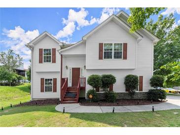 Charming two-story home with red shutters and a well-maintained front lawn at 8436 Cyprus Ridge Way, Douglasville, GA 30134