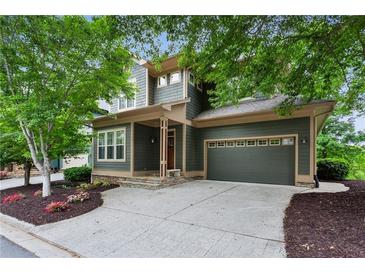 Charming two-story home with a well-manicured lawn and a two-car garage in a leafy neighborhood at 2765 Prado Ln, Marietta, GA 30066