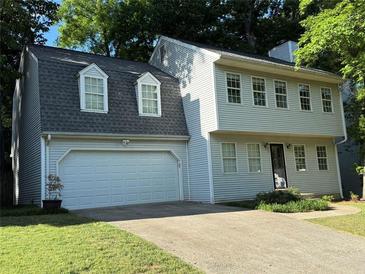 Charming two-story home with a two-car garage, dormer windows, and a well-maintained lawn at 1160 Haven Brook Ne Way, Brookhaven, GA 30319