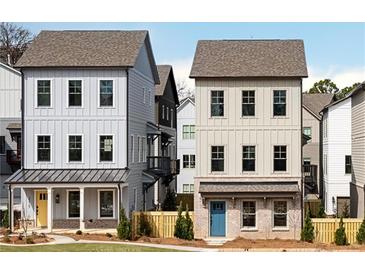 Charming new construction home with inviting front porch and modern design elements at 3319 Stillwood Ln, Hapeville, GA 30354
