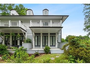 Charming two-story home with a balcony and beautifully landscaped front yard and gray siding at 364 Glendale Ne Ave # B, Atlanta, GA 30307