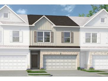 Charming townhome showcasing a brick facade and a convenient two-car garage at 1234 Ravencliff Dr # 81, Austell, GA 30168