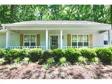 Charming home featuring a welcoming front porch, a landscaped yard, and a well-maintained exterior at 3436 Finglas Dr, Marietta, GA 30008