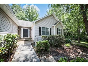 Charming single-story home with neutral siding, black shutters, and a stone accent entryway at 239 Clear Brook Trl, Douglasville, GA 30134