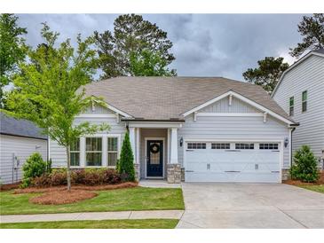 Charming single-story home with a well-manicured lawn and inviting curb appeal at 714 Chipping Sparrow St, Canton, GA 30115