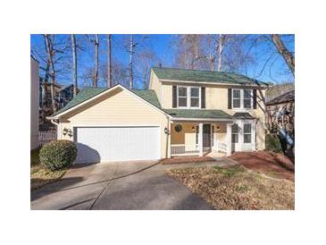 Charming two-story home with a two-car garage and beautifully landscaped front yard at 194 Beaverwood Ct, Lawrenceville, GA 30044