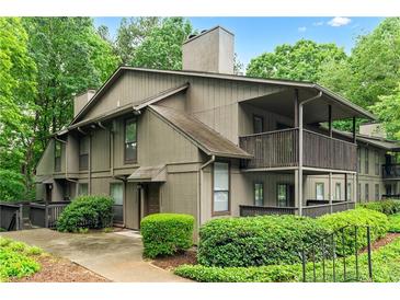 Inviting condo with a private balcony surrounded by lush greenery at 1301 Cumberland Se Ct, Smyrna, GA 30080