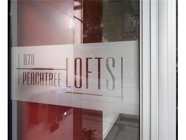 The building sign is visible for 878 Peachtree Lofts in this street-level shot at 878 Peachtree St # 601, Atlanta, GA 30309