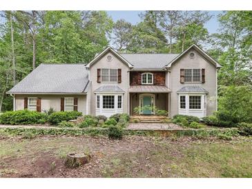Charming two-story home featuring a landscaped yard and a welcoming exterior at 4938 Cedar Lake Ter, Douglasville, GA 30135