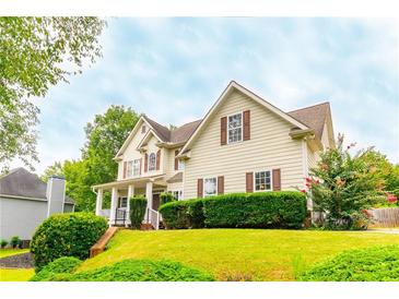 Charming two-story home with a well-manicured front yard and inviting curb appeal at 3725 Falls Trl, Winston, GA 30187