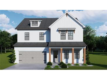 Charming two-story home with white siding, a gray roof, and a manicured lawn, offering classic curb appeal at 406 Westmarch Cir, Loganville, GA 30052