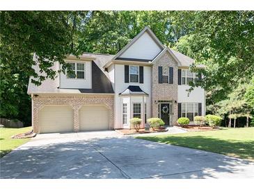 Charming two-story home featuring a two-car garage and well-manicured lawn at 2412 Wingfield Dr, Austell, GA 30106
