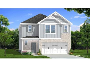 Charming two-story home featuring a brick and gray siding exterior with a two-car garage and well-manicured lawn at 15 Camellia Dr, Fairburn, GA 30213
