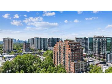 Expansive city view with high rise apartments and neighborhood trees during daytime blue sky at 3180 Mathieson Ne Dr # 1001, Atlanta, GA 30305