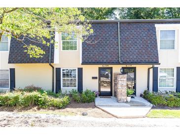 Charming townhome exterior with well-maintained landscaping and visible unit numbers above the doors at 6109 Park Ave, Atlanta, GA 30342