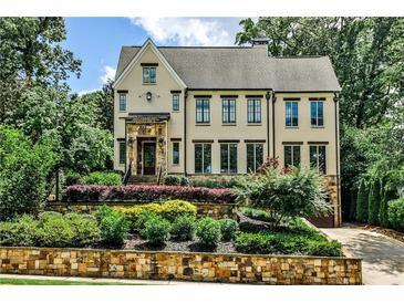 Inviting two-story home with manicured landscaping and stone accents on the front exterior at 171 Beverly Ne Rd, Atlanta, GA 30309