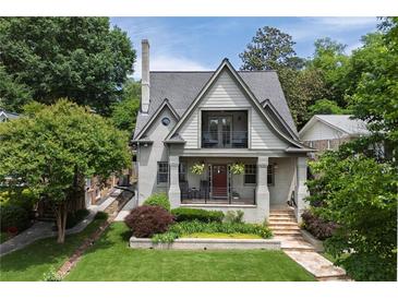 Charming two-story home with a landscaped front yard and inviting front porch at 101 Terrace Dr, Atlanta, GA 30305
