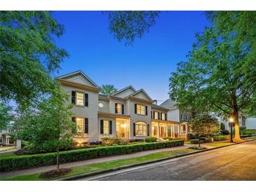 Elegant two-story home showcasing manicured landscaping and classic architectural details at 8109 Lawnview, Alpharetta, GA 30022