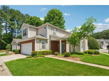 Charming two-story home with well-manicured lawn and inviting curb appeal on a sunny day at 109 Windcroft Nw Cir, Acworth, GA 30101