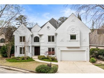Stunning two-story home with unique architectural design and manicured front yard at 4 Vale Close Ne Ct, Atlanta, GA 30324