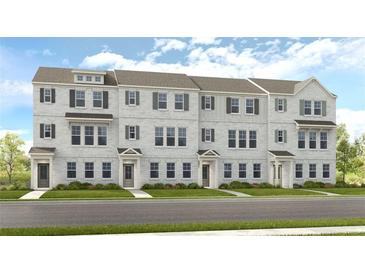 Charming townhome exterior featuring a brick facade, neutral accents, and inviting entryways at 222 Maycrest Path, Tucker, GA 30084