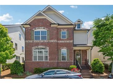 Charming brick front home with manicured landscaping and a welcoming entrance at 3182 Hartford Mill Pl, Duluth, GA 30097