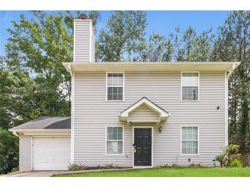 Charming two-story home featuring a classic design and a well-maintained front yard at 5229 Kirk Dr, Atlanta, GA 30349