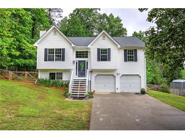 Charming two-story home with a well-manicured lawn and two-car garage at 70 Ashbury Ct, Dallas, GA 30157