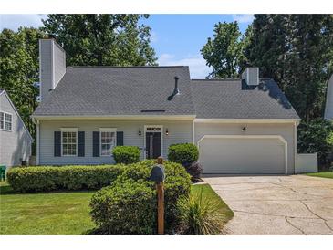 Charming single-Gathering home featuring a two-car garage, a well-manicured lawn, and mature trees at 1175 Haven Brook Ne Way, Brookhaven, GA 30319
