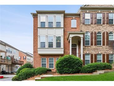 Charming brick townhome with manicured front yard and covered entrance at 2149 Shoop Se Ct # 3, Smyrna, GA 30080