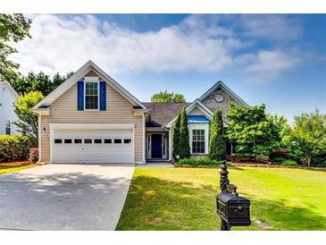 Charming home featuring a well-manicured lawn, classic architecture, and inviting curb appeal at 2721 Maeve Ct, Dacula, GA 30019