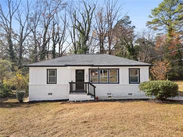 Charming single-story home featuring updated white painted brick and modern black trim details at 1931 Selwyn Dr, Decatur, GA 30035