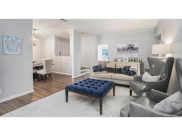 Comfortable living room features stylish seating, decor, and an open floor plan at 5245 Chemin De Vie, Atlanta, GA 30342