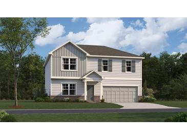 Charming two-story home with gray siding, gray shutters, a two-car garage, and a well-manicured lawn at 2489 Cotton Ln, Douglasville, GA 30135