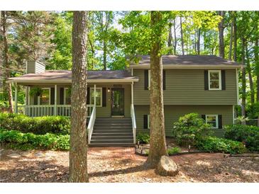 Charming two-story home with an inviting front porch and well-maintained landscaping at 944 Hardy Cir, Dallas, GA 30157