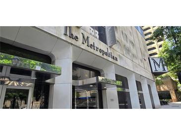 The Metropolitan building features a prominent entrance and classic architectural details at 20 Marietta Nw St # 16A, Atlanta, GA 30303
