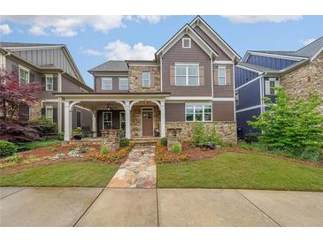 Charming home with stone accents and a beautifully landscaped front yard at 423 Hunt Ne St, Marietta, GA 30060