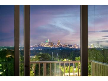 View of city skyline at dusk from home's large windows at 250 Pharr Ne Rd # 716, Atlanta, GA 30305